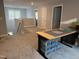 Second floor bonus room area is carpeted with an abundance of natural light from nearby window at 325 Olde Liberty Dr, Youngsville, NC 27596