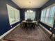 Formal dining room featuring elegant lighting and large windows, perfect for Gathering gatherings at 325 Olde Liberty Dr, Youngsville, NC 27596