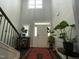 Grand entryway with high ceilings, hardwood floors, and staircase at 325 Olde Liberty Dr, Youngsville, NC 27596