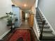 Hallway with hard wood floors and staircase at 325 Olde Liberty Dr, Youngsville, NC 27596