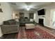 Comfortable living room with a fireplace and hardwood floors at 325 Olde Liberty Dr, Youngsville, NC 27596