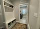 Mudroom features built-in storage, a bench, hooks, and access to the laundry room at 325 Olde Liberty Dr, Youngsville, NC 27596
