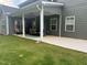 Inviting covered patio featuring an outdoor dining set, perfect for relaxing and entertaining at 325 Olde Liberty Dr, Youngsville, NC 27596