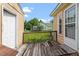A covered back porch provides a relaxing spot to enjoy the outdoors with neighborhood views at 34 Scotts Creek Run, Angier, NC 27501