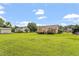 Spacious backyard showcasing lush green grass and partial fencing at 34 Scotts Creek Run, Angier, NC 27501