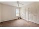 Bedroom with a ceiling fan, one window, carpet, and two closets at 34 Scotts Creek Run, Angier, NC 27501