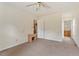 Bright bedroom with neutral walls and a ceiling fan at 34 Scotts Creek Run, Angier, NC 27501