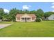 Charming single-story home with a well-manicured lawn and mature trees at 34 Scotts Creek Run, Angier, NC 27501