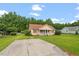 Well-kept single-story home with a spacious front yard and inviting curb appeal at 34 Scotts Creek Run, Angier, NC 27501