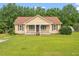 Inviting single-story home featuring a classic design and well-maintained lawn at 34 Scotts Creek Run, Angier, NC 27501