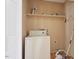 Laundry area with a white washing machine and storage shelves at 34 Scotts Creek Run, Angier, NC 27501