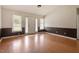 The light and airy living room features large windows at 34 Scotts Creek Run, Angier, NC 27501