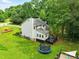 Spacious backyard features a deck, trampoline, and plenty of room for outdoor activities and relaxation at 3421 Kistler Ct, Willow Springs, NC 27592