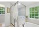 Bright bathroom features a glass-enclosed shower and soaking tub for a spa-like experience at 3421 Kistler Ct, Willow Springs, NC 27592