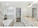 Well-appointed bathroom with soaking tub, double vanity, and stylish tile work, creating a spa-like experience at 3421 Kistler Ct, Willow Springs, NC 27592