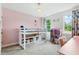 ' bedroom featuring a loft bed, pink accent wall, and charming decor at 3421 Kistler Ct, Willow Springs, NC 27592