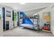 Bedroom featuring a gray metal bunk bed with blue accent wall and playful decor at 3421 Kistler Ct, Willow Springs, NC 27592