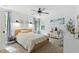 Inviting bedroom with natural light, ceiling fan, neutral tones, and tasteful decor create a calming retreat at 3421 Kistler Ct, Willow Springs, NC 27592