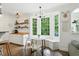 Inviting breakfast nook with bench seating, bay windows, and contemporary lighting at 3421 Kistler Ct, Willow Springs, NC 27592
