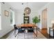 Well-lit dining room featuring a modern light fixture, wood table, and neutral colors at 3421 Kistler Ct, Willow Springs, NC 27592