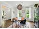 Well-lit dining room featuring a modern light fixture, wood table, and neutral colors at 3421 Kistler Ct, Willow Springs, NC 27592
