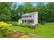Beautiful home exterior with a manicured lawn, trampoline, and lovely landscaping at 3421 Kistler Ct, Willow Springs, NC 27592