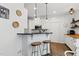 Modern kitchen featuring granite countertops, stainless steel appliances, and counter seating at 3421 Kistler Ct, Willow Springs, NC 27592