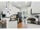Well-lit kitchen showcasing stainless steel appliances, granite countertops, and open layout at 3421 Kistler Ct, Willow Springs, NC 27592