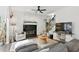 Cozy living room with fireplace, plush seating, decorative rug, and elegant decor, creating a welcoming atmosphere at 3421 Kistler Ct, Willow Springs, NC 27592
