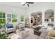 Sunlit living room with hardwood floors, comfortable seating, and views of the outdoors at 3421 Kistler Ct, Willow Springs, NC 27592