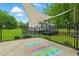 Outdoor patio with a colorful rug and a trampoline, offering space for relaxation and play at 3421 Kistler Ct, Willow Springs, NC 27592