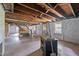 Spacious unfinished basement with staircase and windows ready for renovation at 4053 Friendship Patterson Mill Road, Burlington, NC 27215