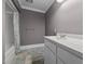 Cozy bathroom featuring patterned tile floor, a tub, and vanity with a white countertop at 4053 Friendship Patterson Mill Road, Burlington, NC 27215