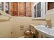 Powder room with a vintage yellow tile, toilet and sink at 4053 Friendship Patterson Mill Road, Burlington, NC 27215