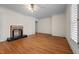 Bedroom with a fireplace and hardwood floors at 4053 Friendship Patterson Mill Road, Burlington, NC 27215
