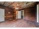 Bedroom featuring unfinished wood, flooring and ceiling, plus exposed insulation at 4053 Friendship Patterson Mill Road, Burlington, NC 27215