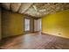 Bedroom with wood paneled walls and exposed insulation at 4053 Friendship Patterson Mill Road, Burlington, NC 27215