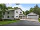 Charming two-story home with a detached two car garage and well-manicured lawn at 4053 Friendship Patterson Mill Road, Burlington, NC 27215