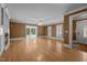 Bright and airy living room with large windows, a fireplace, and hardwood flooring at 4053 Friendship Patterson Mill Road, Burlington, NC 27215