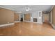 Large living room featuring a fireplace, hardwood floors, and access to other rooms at 4053 Friendship Patterson Mill Road, Burlington, NC 27215