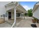 Spacious covered patio with concrete flooring and ceiling fans, perfect for outdoor entertaining at 4053 Friendship Patterson Mill Road, Burlington, NC 27215