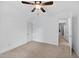 A bedroom features neutral carpet, white walls, ceiling fan, and access to other rooms in the house at 4067 Williams Mill Rd, Burlington, NC 27215