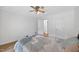 Comfortable bedroom with hardwood floors and a ceiling fan offers a tranquil retreat at 4067 Williams Mill Rd, Burlington, NC 27215