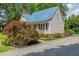 Charming single-Gathering home with a blue metal roof and well-manicured landscaping at 4067 Williams Mill Rd, Burlington, NC 27215