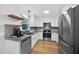 Bright kitchen featuring granite counters, stainless appliances and hardwood floors at 4067 Williams Mill Rd, Burlington, NC 27215