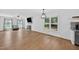 Open-concept living room with hardwood floors, fireplace, and plenty of natural light at 4067 Williams Mill Rd, Burlington, NC 27215