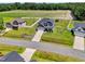 An aerial view of a beautifully landscaped property, showcasing the home's setting, lawn, and surrounding neighborhood at 414 Fallingbrook Dr, Kenly, NC 27542