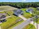 An aerial shot of a property with a large lot, showcasing the home, backyard, and surrounding neighborhood at 414 Fallingbrook Dr, Kenly, NC 27542