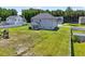 Spacious backyard with a covered patio perfect for outdoor seating and entertaining, surrounded by lush greenery at 414 Fallingbrook Dr, Kenly, NC 27542