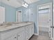 Bright bathroom with double sinks and granite countertops, with a separated shower area at 414 Fallingbrook Dr, Kenly, NC 27542